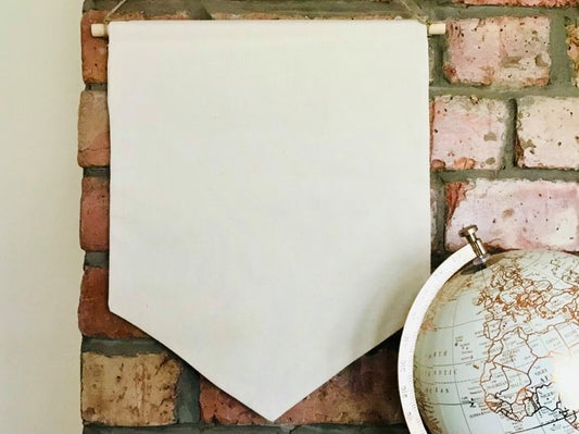 a blank natural coloured canvas banner ready to decorate or add collection of enamel pins