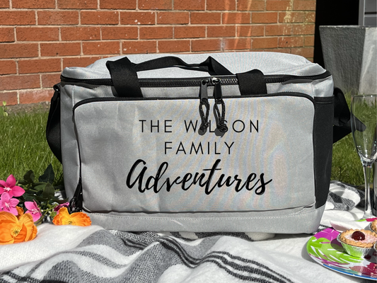 a grey insulated picnic cooler bag, personalised with a family name 